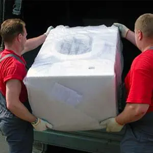 Аккуратная упаковка стиральной машины для транспортировки